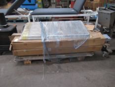 A Pallet of Dismantled Commputer Tables.