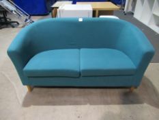 A Blue Small 2 Seater Sofa