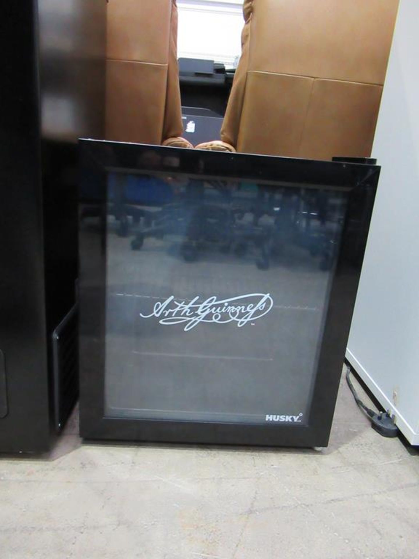 A Husky HUS-EL187-HU Small Glass Fronted Counter Top Display Fridge "Guinness Branded"