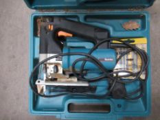 A Bosch 14.4V Drill (no charger) together with a Makita 240V Jigsaw