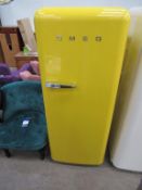 Yellow Smeg Upright Refrigerator Freezer.