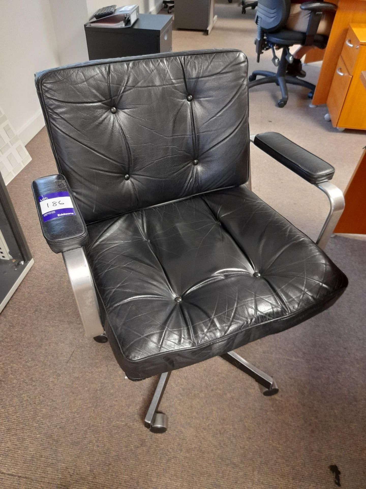 4 x Black leather meeting chairs (contents excluded)
