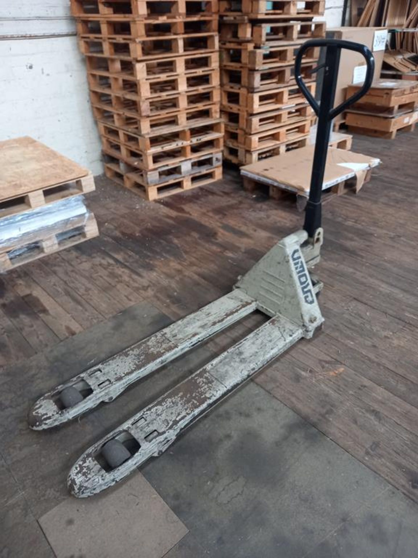 A Crown 2000KG Capacity Pedestrian Pallet Truck