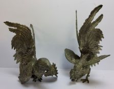 A pair of early 20th century pewter cock fighting models, 15cm high