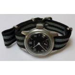 A Bulova 1952 Military Issue "1917-H", 10 jewel movment, black dial, Arabic numerals, white hands,