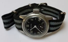 A Bulova 1952 Military Issue "1917-H", 10 jewel movment, black dial, Arabic numerals, white hands,