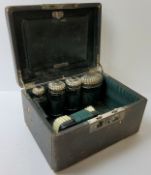 An early 20th century Moroccan leather travelling vanity set, complete with silver plated vanity