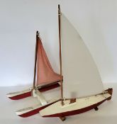 A scratch built pond yacht, red hull, stand; another catamaran (2)