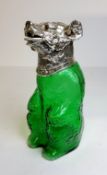 A novelty green glass decanter, in the form of a bear, with plated metal mounts, 23 cm high