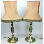 A pair of Neo Classical style brushed silvered metal table lamps with pink shades, 20th century,