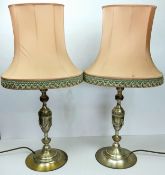A pair of Neo Classical style brushed silvered metal table lamps with pink shades, 20th century,