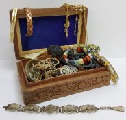 A carved Indian jewellery box, full of costume jewellery including Whitby jet mourning brooch,