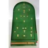 A Chad Valley bagatelle board with the original scoreboard and steel balls