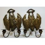 An unusual pair of large bronze bat wall sconces