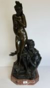 An impressive and large Orientalist patinated bronze figural group of an Arabian slave trader with a