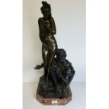 An impressive and large Orientalist patinated bronze figural group of an Arabian slave trader with a