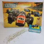 A Scalextric Grand Prix model motor racing set, No 75, includes fly over bridge and change overs 1