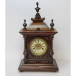 A walnut cased H.A.C. 14 day strike mantel clock, striking on a coiled gong. bevelled glass