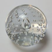 A Whitefriars large clear glass paperweight, bubble inclusions,approx. 9cms diameter