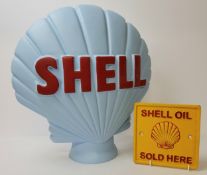 A large plaster reproduction of a Shell 1/2 globe 45cms; a cast iron plaque Shell Oil Sold Here (2)