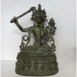 A monumental bronze of Green Tara, Tibet, in 17th century style, seated cross-legged on a lotus