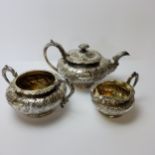 A George III and George IV conforming silver three piece tea set, hallmarked Joseph Angell I, London