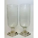 A pair of substantial cut glass storm lanterns, heavy stepped square base, 41cm / 17".