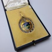 Local interest - a 9ct gold and enamel medallion, the obverse mounted with enamelled Sheffield