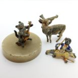 Two cold painted bronze miniatures, including a cat and the fiddle model on an alabaster plinth