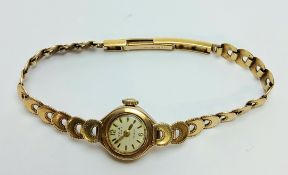 A 9ct gold lady's AVIA wristwatch, 17 jewel movement, integral 9ct gold bracelet hallmarked, J A
