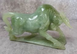 A carved jade charging bull
