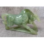 A carved jade charging bull