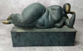 A verdigris bronze abstract nude raised on a plinth base, 12" long
