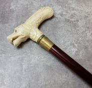 A 19th century Chinese novelty walking stick pommel, carved bone in the form of a dogs head with