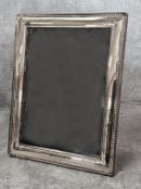 A modern sterling silver photo frame, Sheffield, 21cm High x 16.5cm (inside measurements = 17cm x
