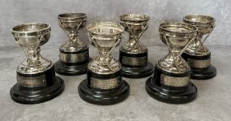 Golfing Interest - a set of six early golf trophies, all presented to Reg Horne, all with silver