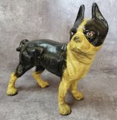 A cast iron door stop in the form of a French bull dog