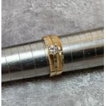 An American 14ct gold solitaire ring, set with a 1/4ct brilliant cut diamond, diamond cut shank