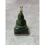 A 19th century spinach jade buddha pendant, white metal mounted, 5cm high