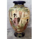 A Japanese Satsuma baluster shaped vase decorated with an affluent lady of Title with her