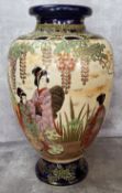 A Japanese Satsuma baluster shaped vase decorated with an affluent lady of Title with her