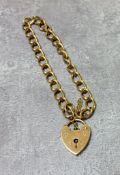 A 9ct gold charm bracelet, heart shaped padlock clasp, LC, London 1972 9.25g