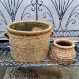 A large terracotta cylindrical planter; a smaller wheel spun planter (2)