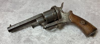 An 19th century EIG rim fire six shot revolver with folding trigger, octagonal barrel wooden