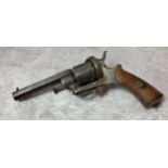 An 19th century EIG rim fire six shot revolver with folding trigger, octagonal barrel wooden
