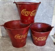 Advertisement- a set of three graduated Coca Cola buckets