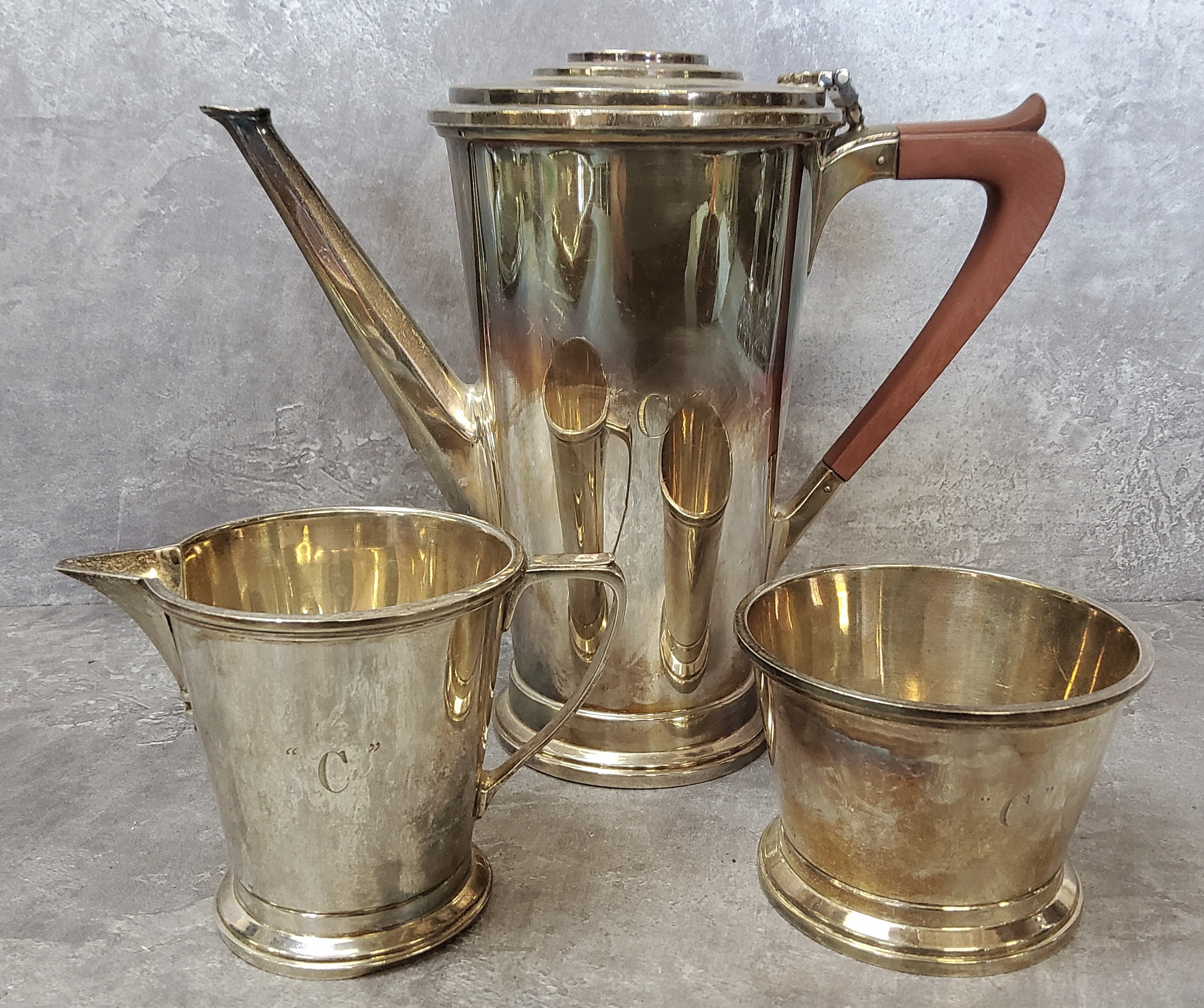 A silver Adie Brothers Ltd three piece coffee service, including coffee pot, cream jug and sugar