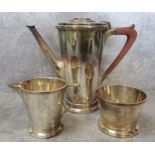 A silver Adie Brothers Ltd three piece coffee service, including coffee pot, cream jug and sugar