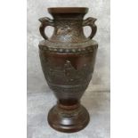 A Japanese 'Meiji period' bronze baluster shaped temple vase, decorated in relief with a bats