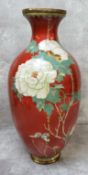A large Japanese Meiji period cloisonne baluster vase, bold red ground decorated with blossoming